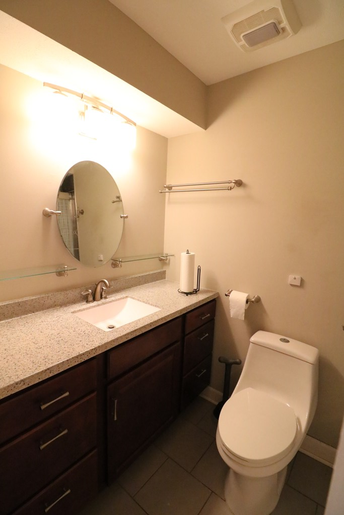 7 Primrose Court Columbus, GA 31907 - Photo 14 of 37 a bathroom with a toilet sink and mirror