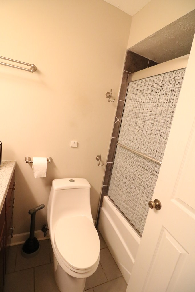 7 Primrose Court Columbus, GA 31907 - Photo 15 of 37 a white toilet sitting next to a shower