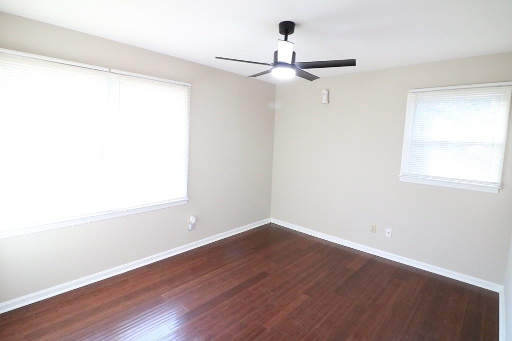 7 Primrose Court Columbus, GA 31907 - Photo 20 of 37 a view of a small space with wooden floor a ceiling fan and a window