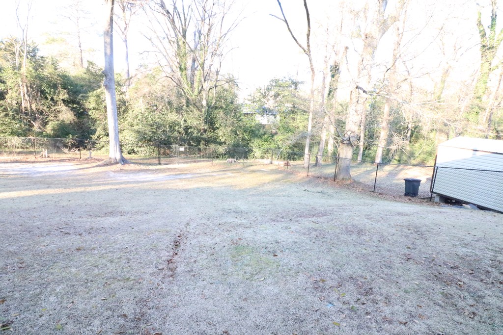 7 Primrose Court Columbus, GA 31907 - Photo 27 of 37 a view of a yard with large trees