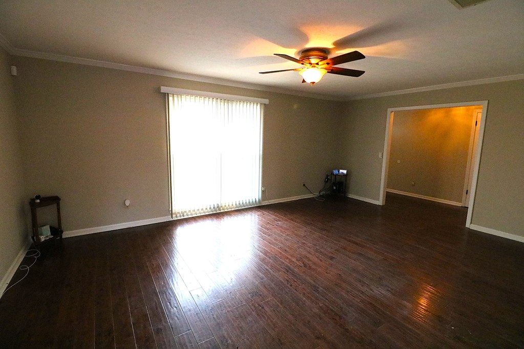 7 Primrose Court Columbus, GA 31907 - Photo 6 of 37 an empty room with wooden floor and windows