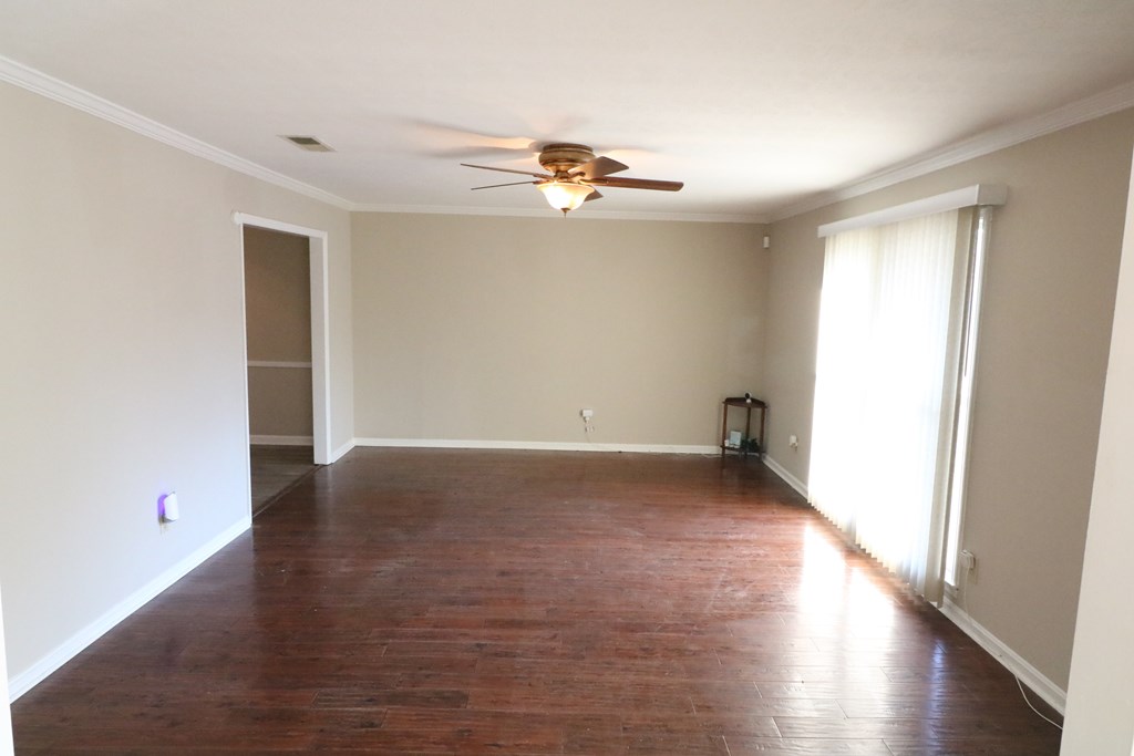 7 Primrose Court Columbus, GA 31907 - Photo 7 of 37 wooden floor in an empty room with a window