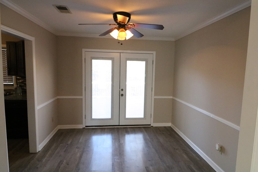 7 Primrose Court Columbus, GA 31907 - Photo 8 of 37 wooden floor in an empty room with a window