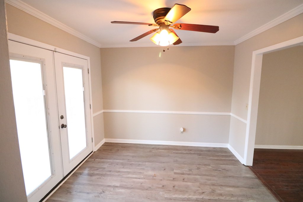 7 Primrose Court Columbus, GA 31907 - Photo 9 of 37 wooden floor in an empty room with a window
