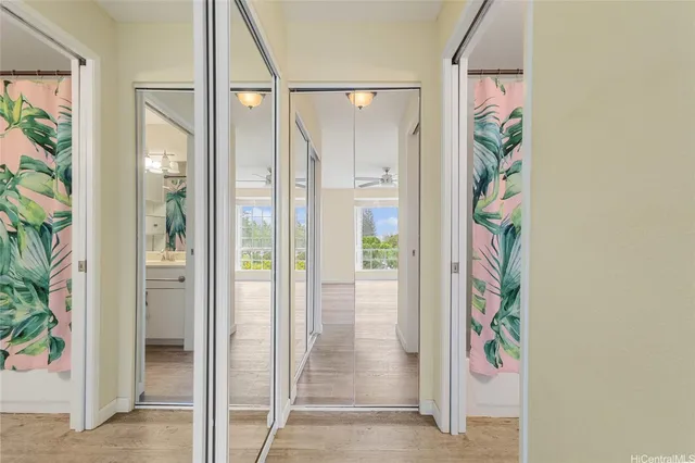 view of a bathroom with a glass door and shower