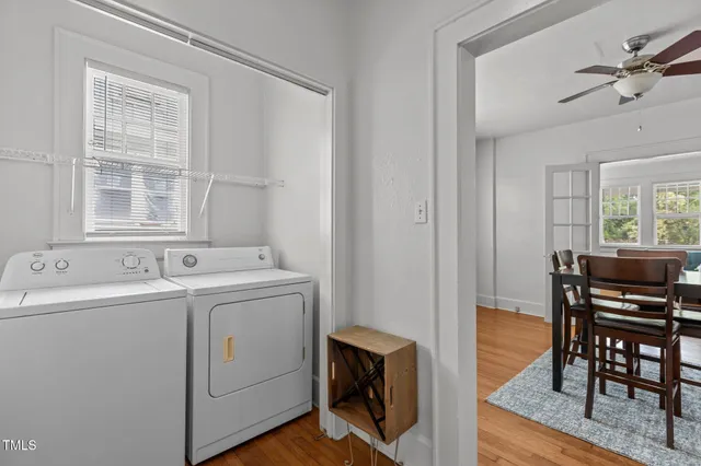 a view of a dining room with furniture and wooden floor