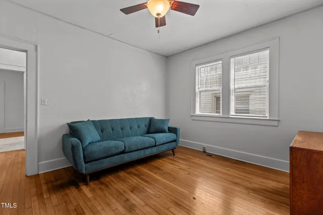 a kitchen with white cabinets and appliances