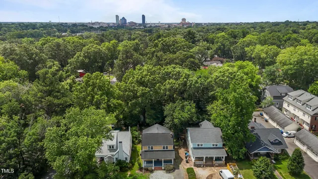 a view of a house with a yard and a garden