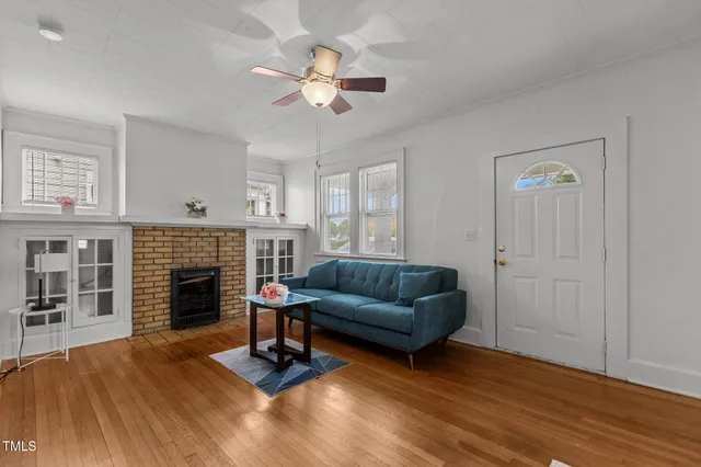 a living room with furniture and a fireplace