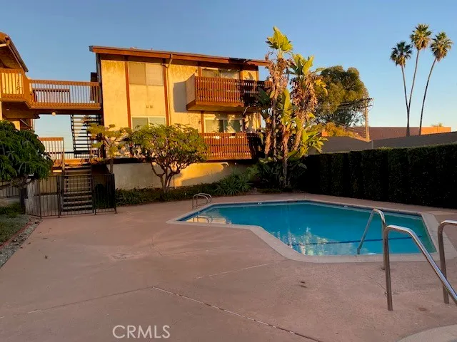 a view of a swimming pool with a yard
