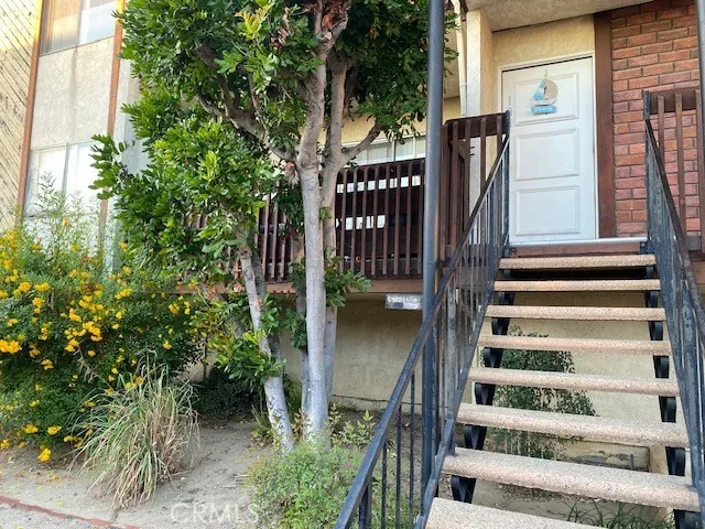 a view of staircase with wooden floor and fence