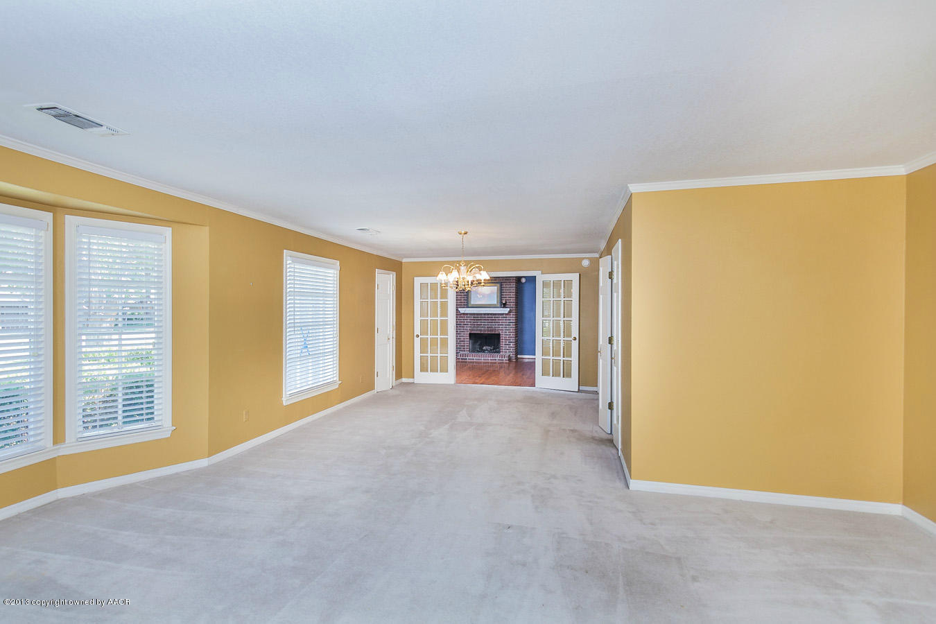6707 Jameson Road Amarillo, TX 79106 - Photo 3 of 28 a view of an empty room with a window
