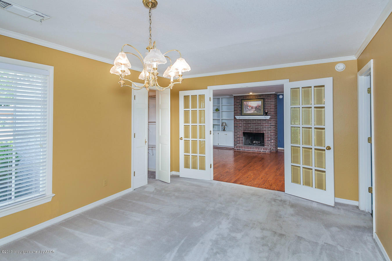 6707 Jameson Road Amarillo, TX 79106 - Photo 4 of 28 a view of a livingroom with a chandelier furniture and windows