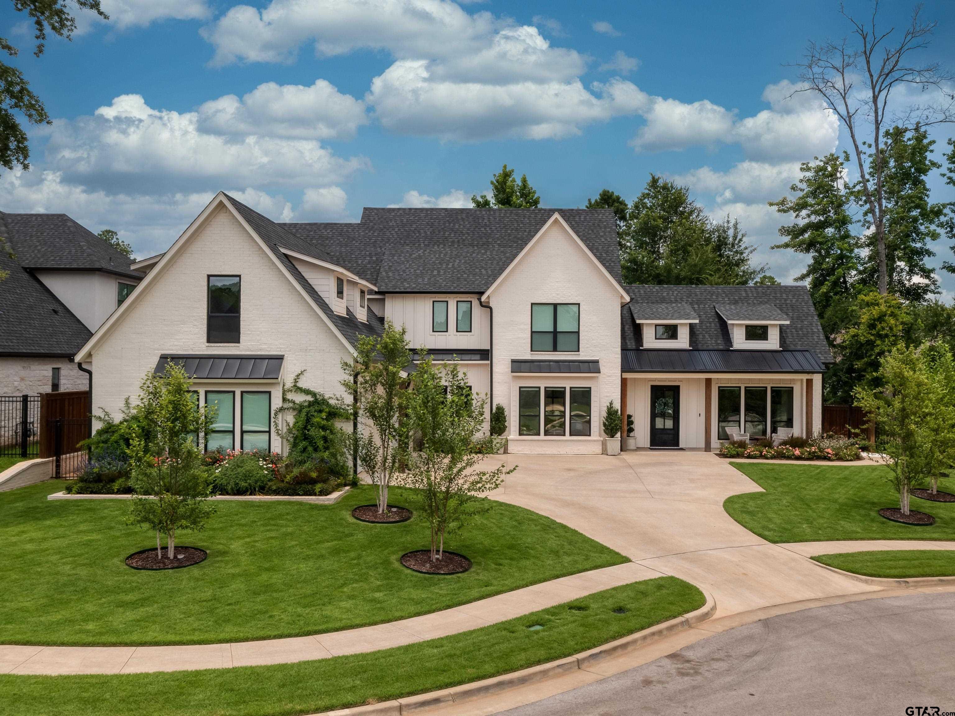 1555 Maple Lane Tyler, TX 75703 - Photo 2 of 43 a front view of a house with a yard