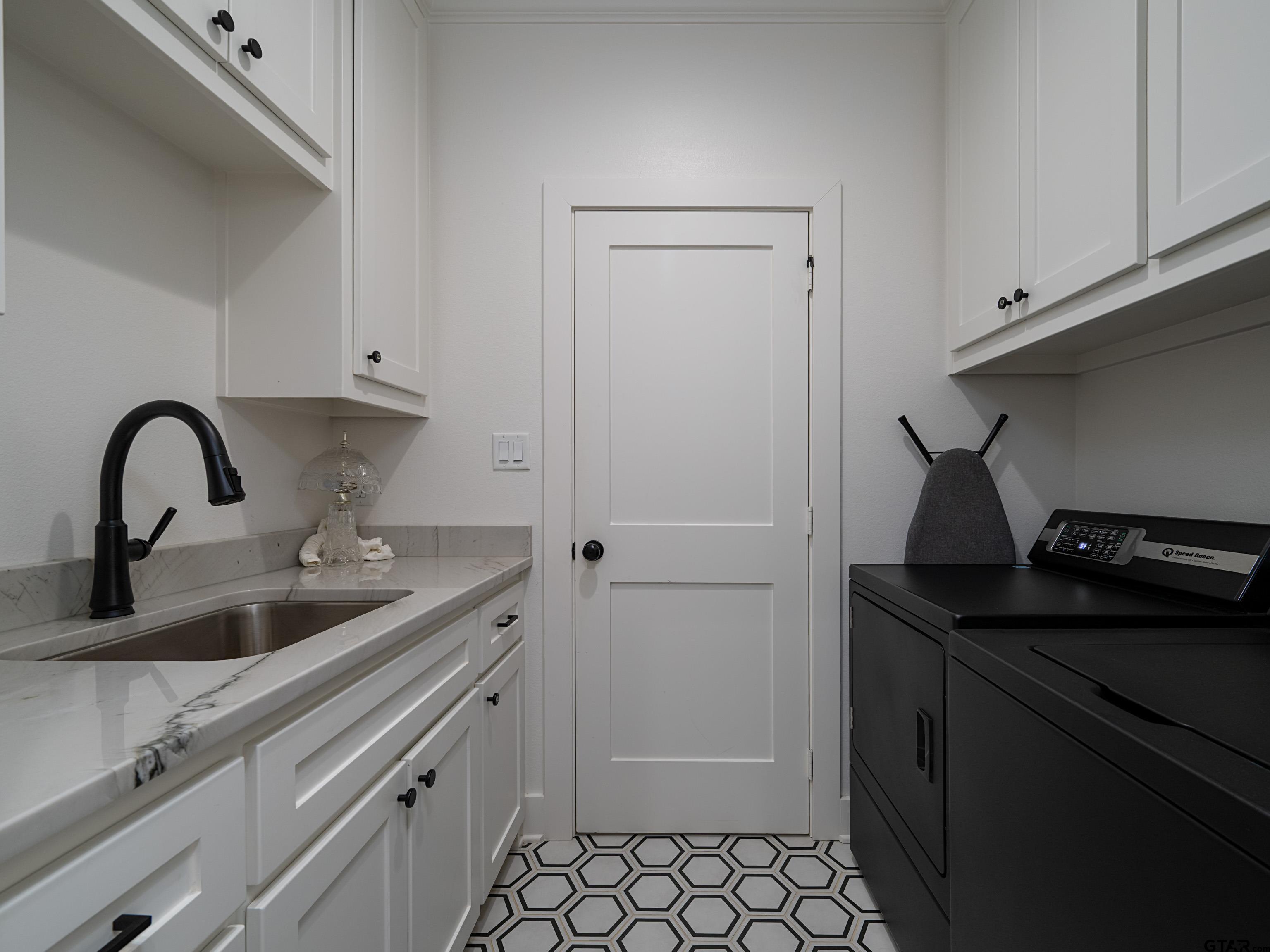 1555 Maple Lane Tyler, TX 75703 - Photo 24 of 43 a close view of a sink and cabinets