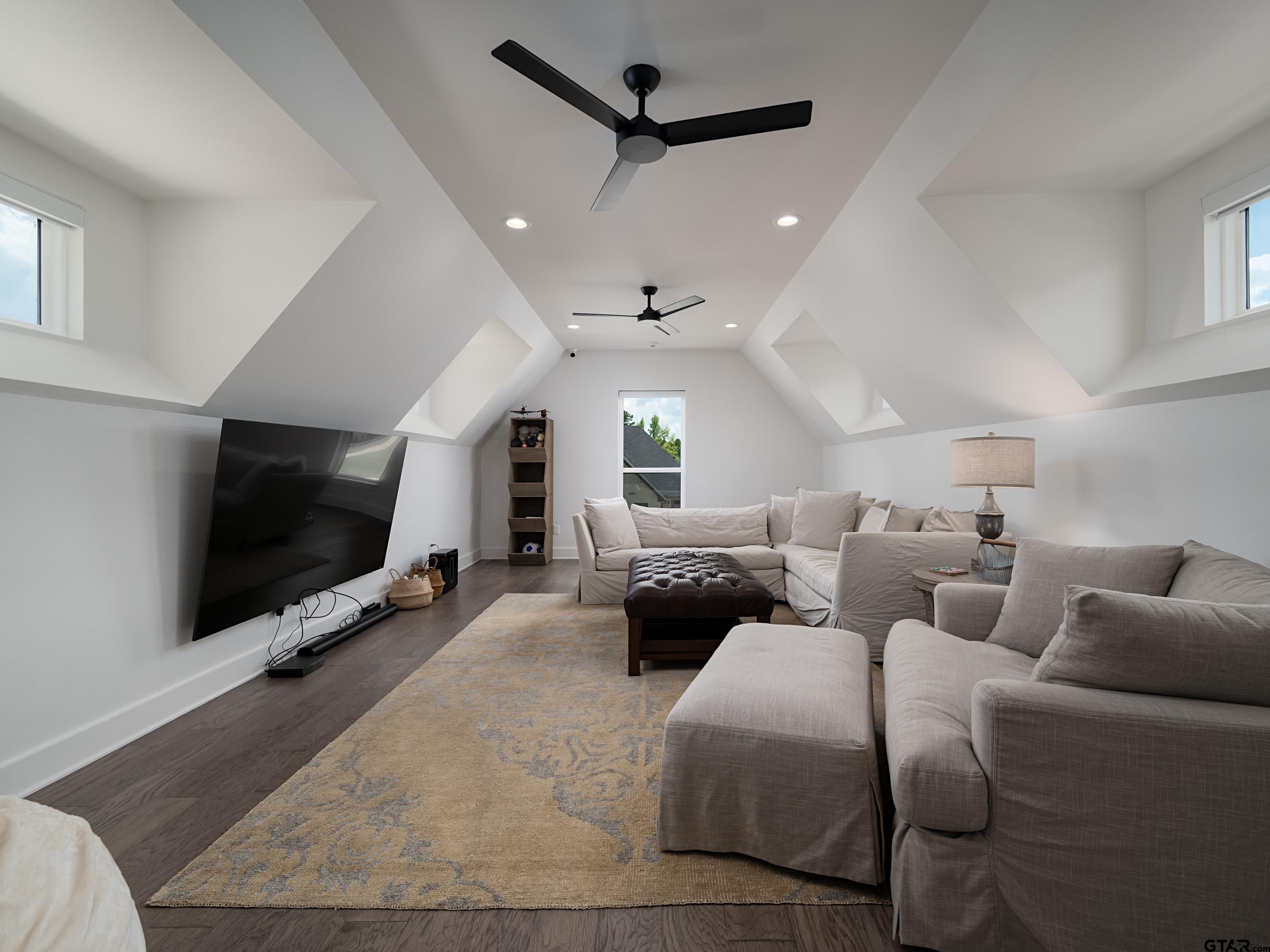 1555 Maple Lane Tyler, TX 75703 - Photo 27 of 43 a living room with furniture and a flat screen tv