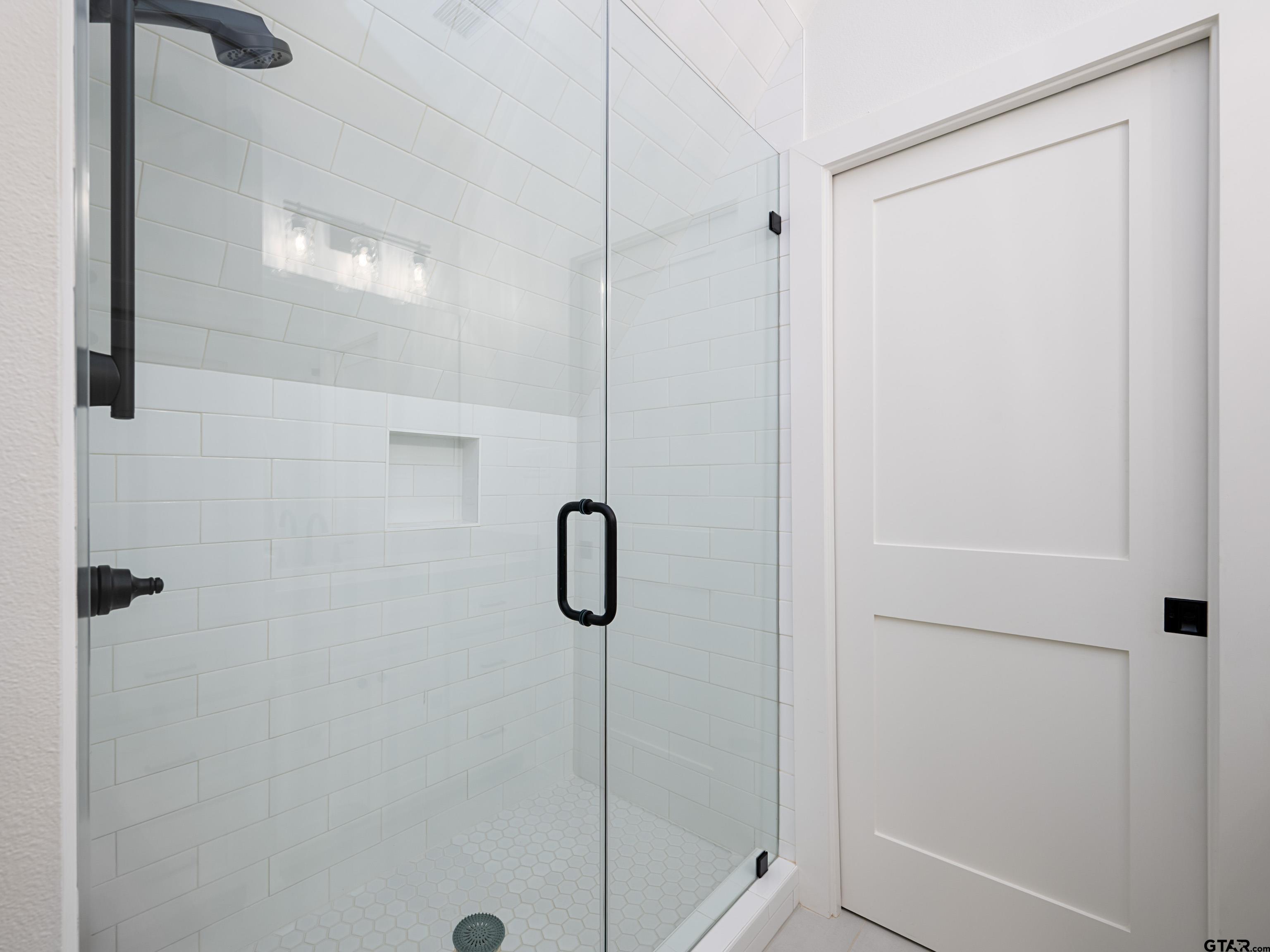 1555 Maple Lane Tyler, TX 75703 - Photo 30 of 43 a bathroom with a shower