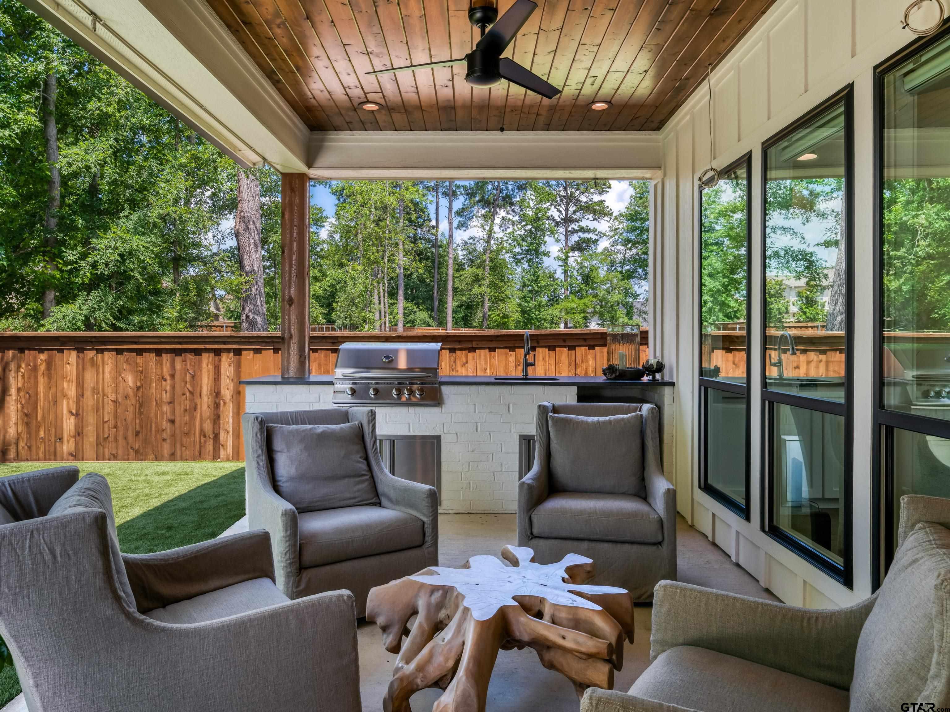 1555 Maple Lane Tyler, TX 75703 - Photo 32 of 43 a outdoor living space with furniture and outdoor view