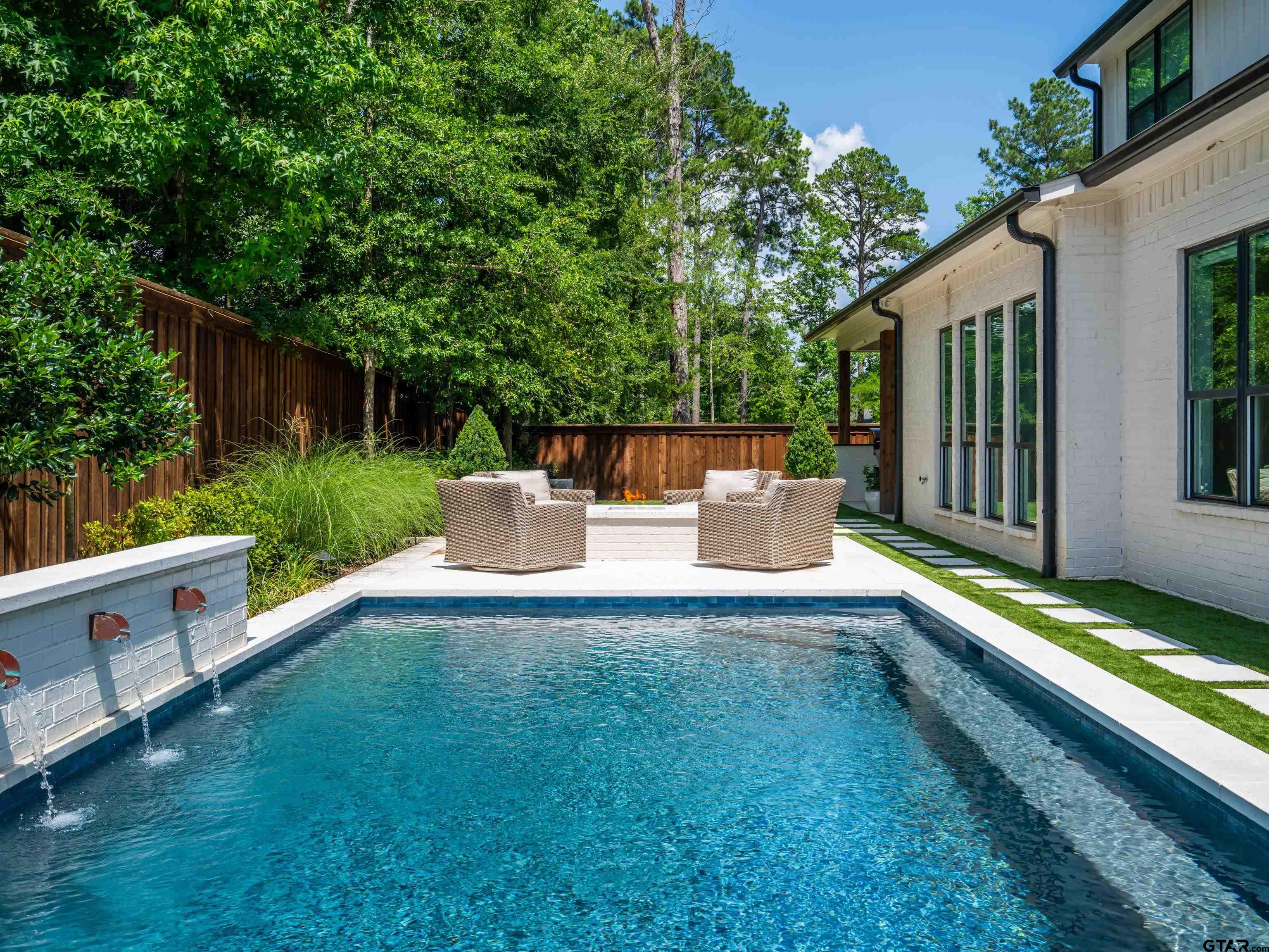 1555 Maple Lane Tyler, TX 75703 - Photo 43 of 43 a view of a chair and tables in the backyard