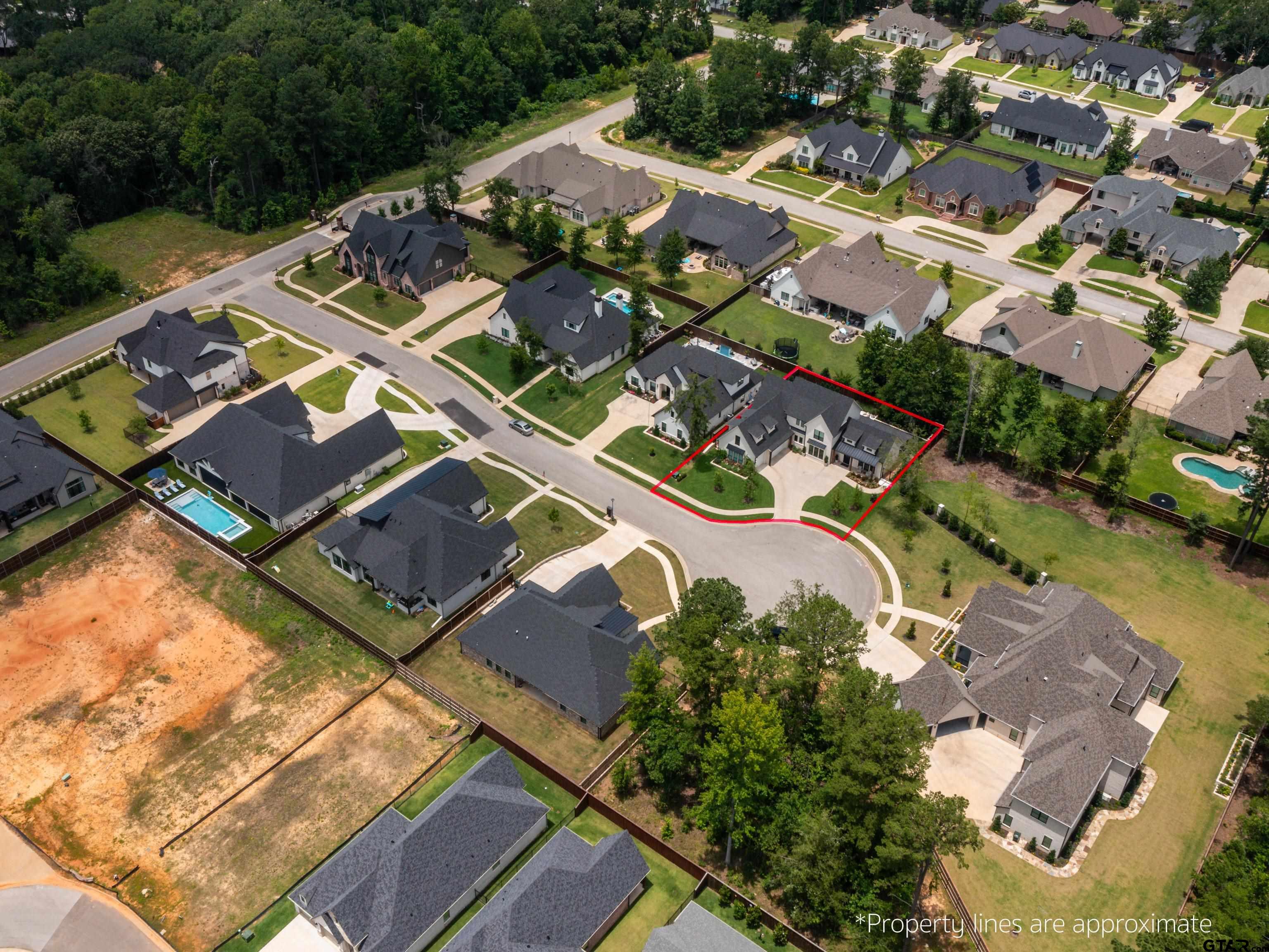 1555 Maple Lane Tyler, TX 75703 - Photo 5 of 43 an aerial view of a house with a ocean view