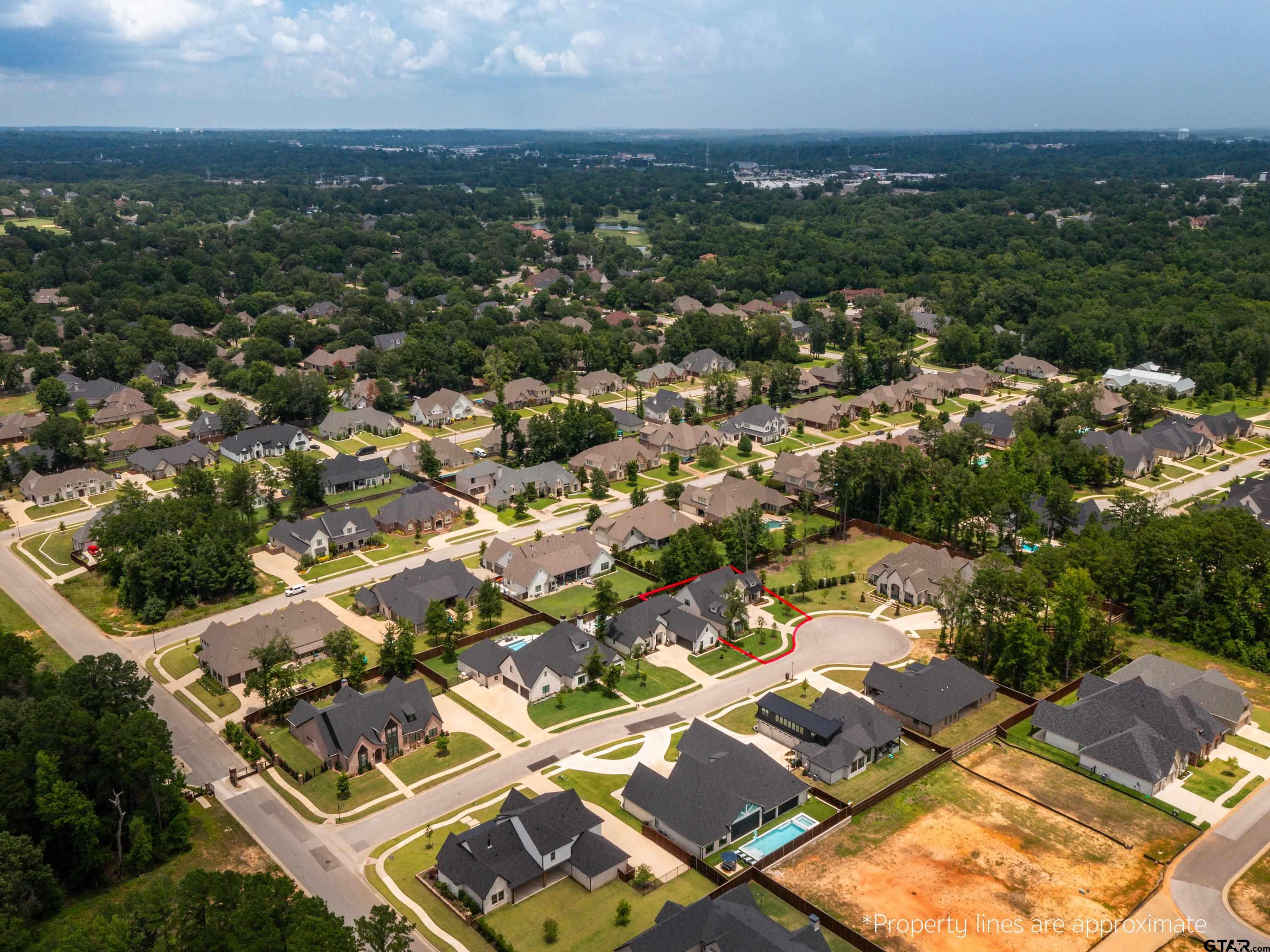 1555 Maple Lane Tyler, TX 75703 - Photo 6 of 43 an aerial view of residential building with parking