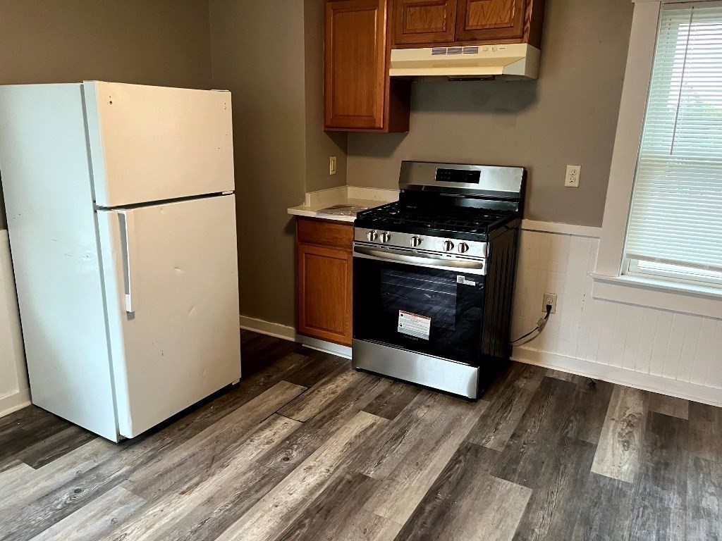 9 Pearl Street, Unit 2 Spencer, MA 01562 - Photo 3 of 12 a stove top oven sitting inside of a kitchen