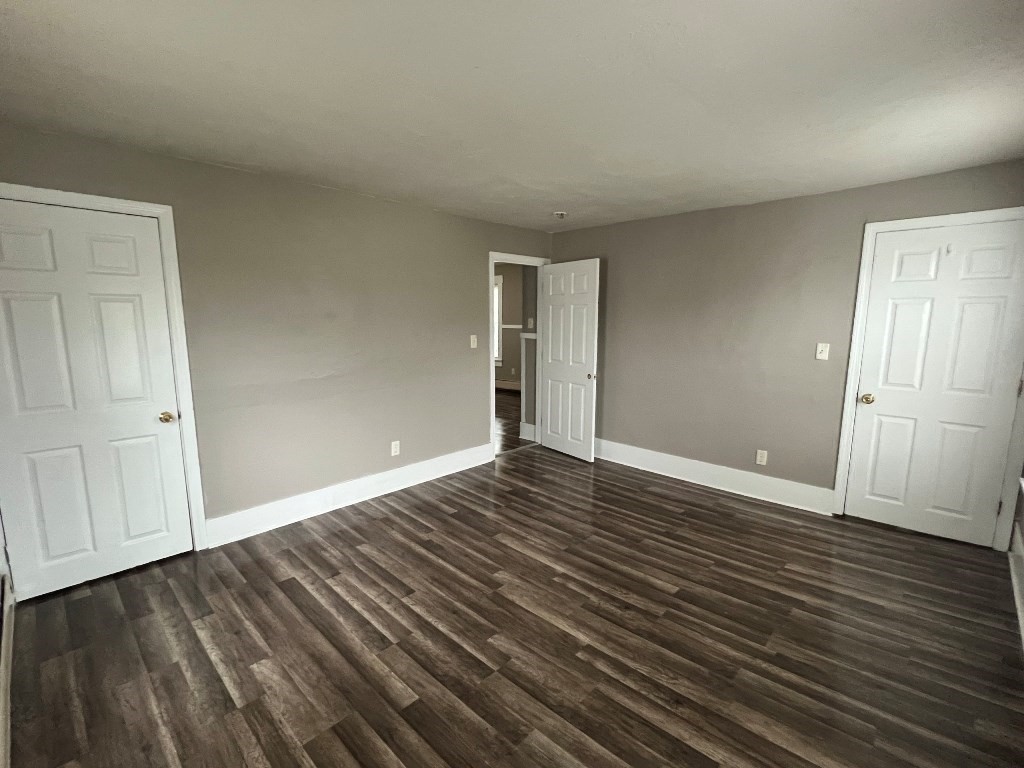9 Pearl Street, Unit 2 Spencer, MA 01562 - Photo 9 of 12 a view of an empty room with wooden floor