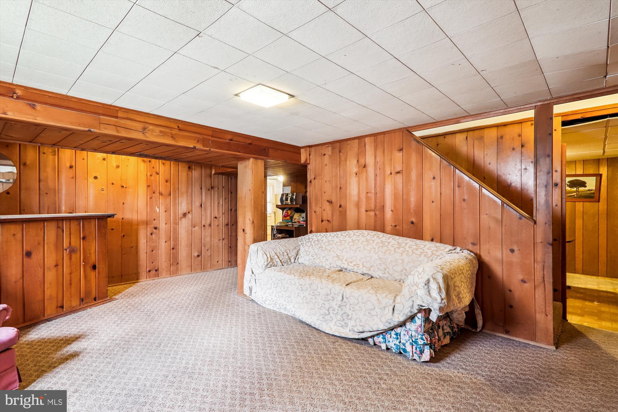 9507 Adelphi Road Silver Spring, MD 20903 - Photo 32 of 41 a bedroom with a bed and wooden floor