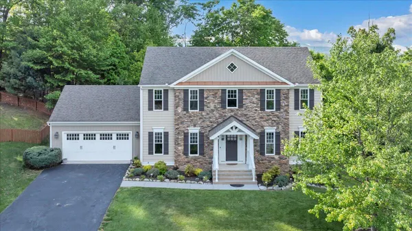 front view of a house with a yard