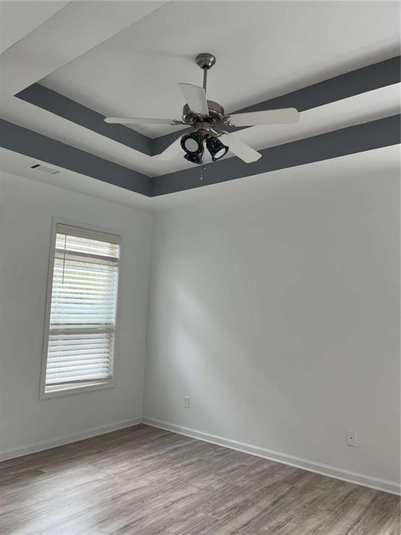 6127 Landers Loop Fairburn, GA 30213 - Photo 11 of 20 wooden floor in an empty room with a window