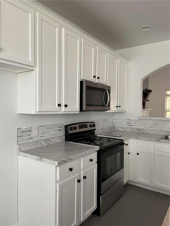 6127 Landers Loop Fairburn, GA 30213 - Photo 10 of 20 a kitchen with granite countertop white cabinets and a sink