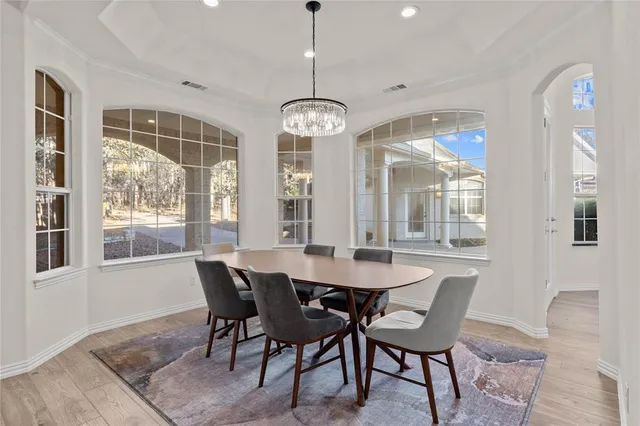 a kitchen with stainless steel appliances a refrigerator sink and microwave