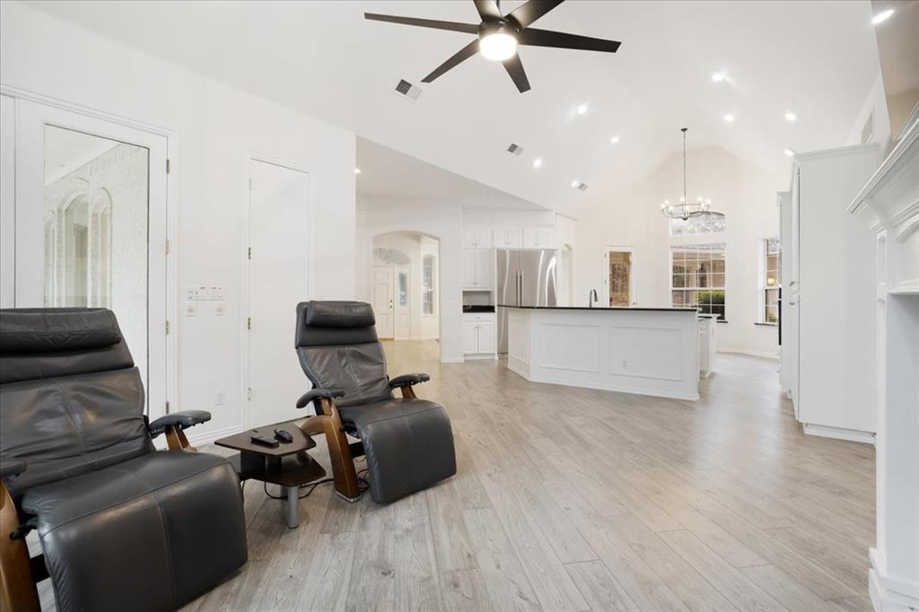 10984 Stagecoach Pass Pilot Point, TX 76258 - Photo 15 of 40 a living room with furniture and a wooden floor
