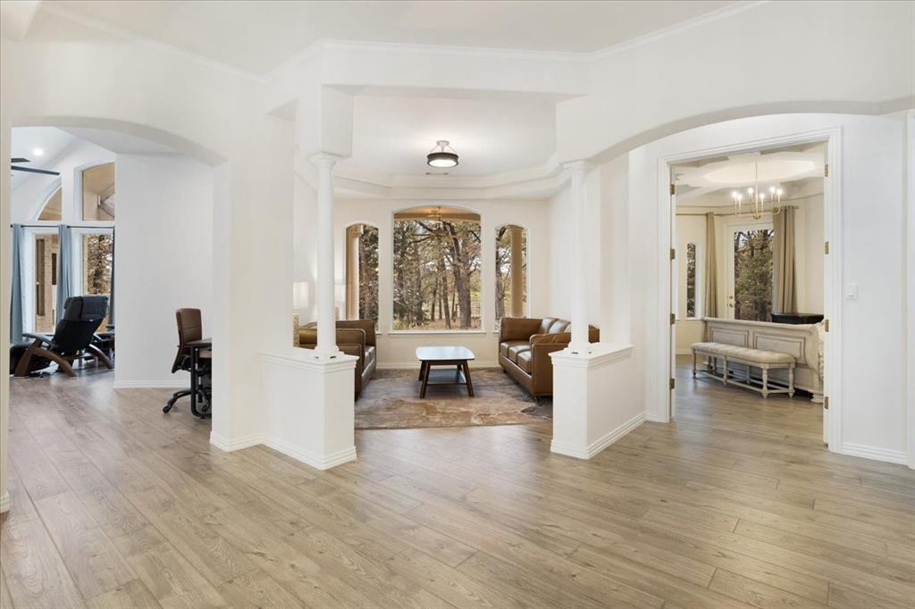 10984 Stagecoach Pass Pilot Point, TX 76258 - Photo 17 of 40 a living room with furniture and a wooden floor