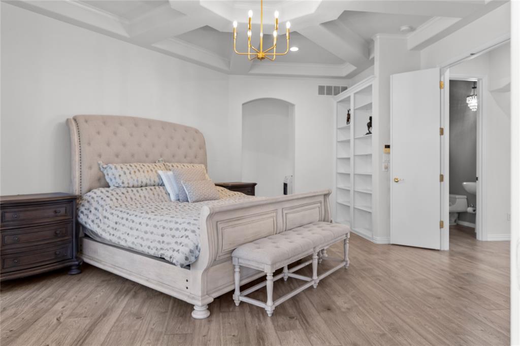 10984 Stagecoach Pass Pilot Point, TX 76258 - Photo 21 of 40 a bedroom with bed and wooden floor