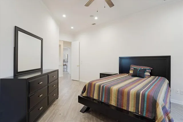 a bedroom with a bed and a table