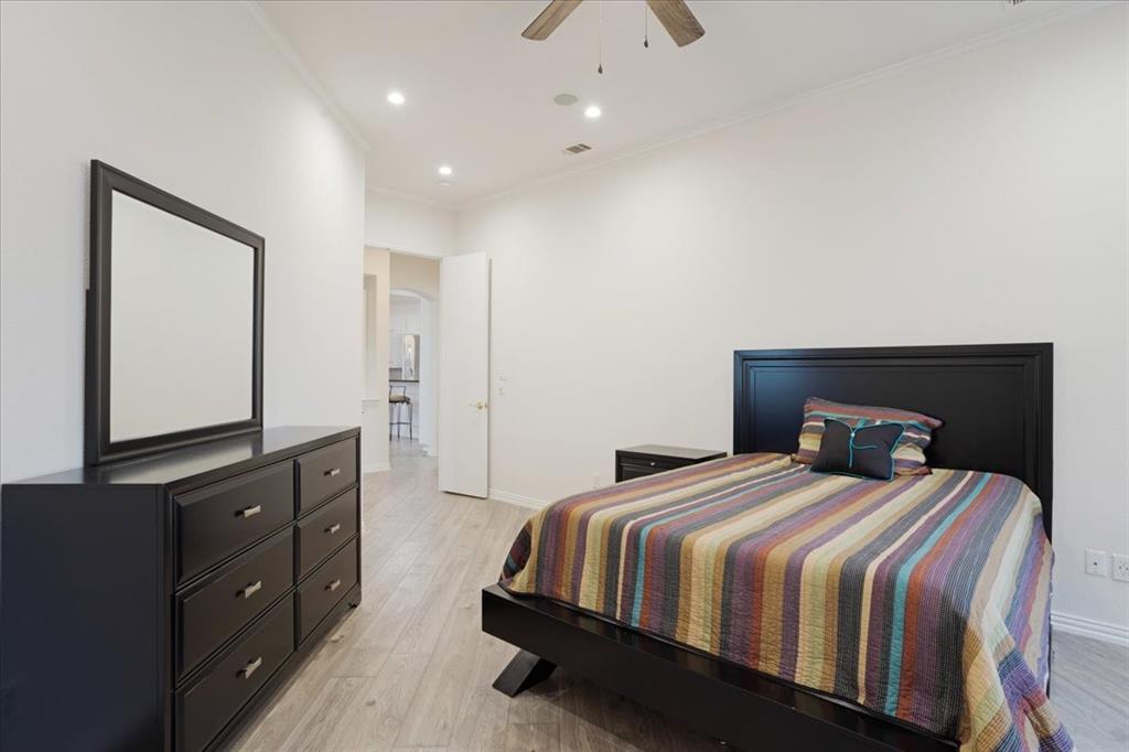 10984 Stagecoach Pass Pilot Point, TX 76258 - Photo 24 of 40 a bedroom with a bed and a dresser