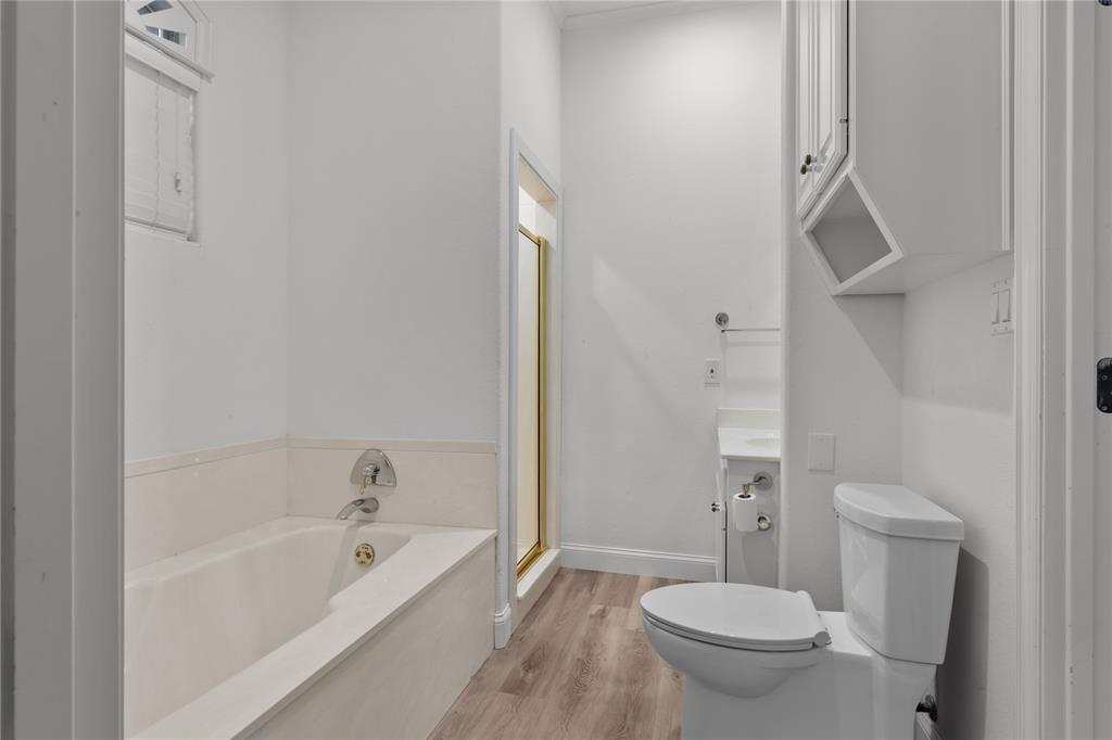 10984 Stagecoach Pass Pilot Point, TX 76258 - Photo 27 of 40 a white toilet sitting next to a bath tub