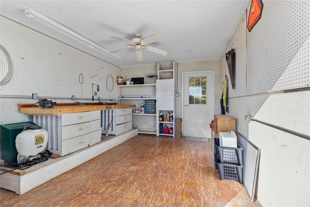 10984 Stagecoach Pass Pilot Point, TX 76258 - Photo 32 of 40 a kitchen with stainless steel appliances granite countertop a sink and cabinets