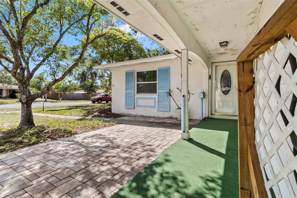 6221 Dalton Street Spring Hill, FL 34606 - Photo 31 of 40 a house with garden in front of it