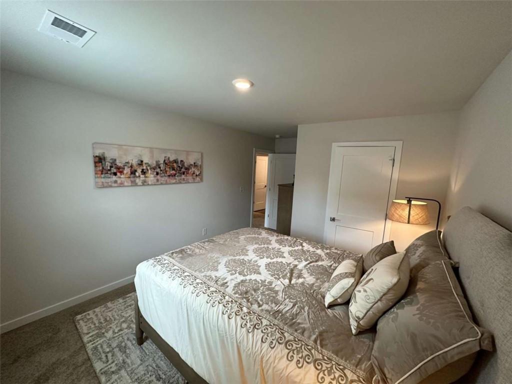 5372 Tolar Road South Fulton, GA 30213 - Photo 24 of 26 a bedroom with a bed and a mirror