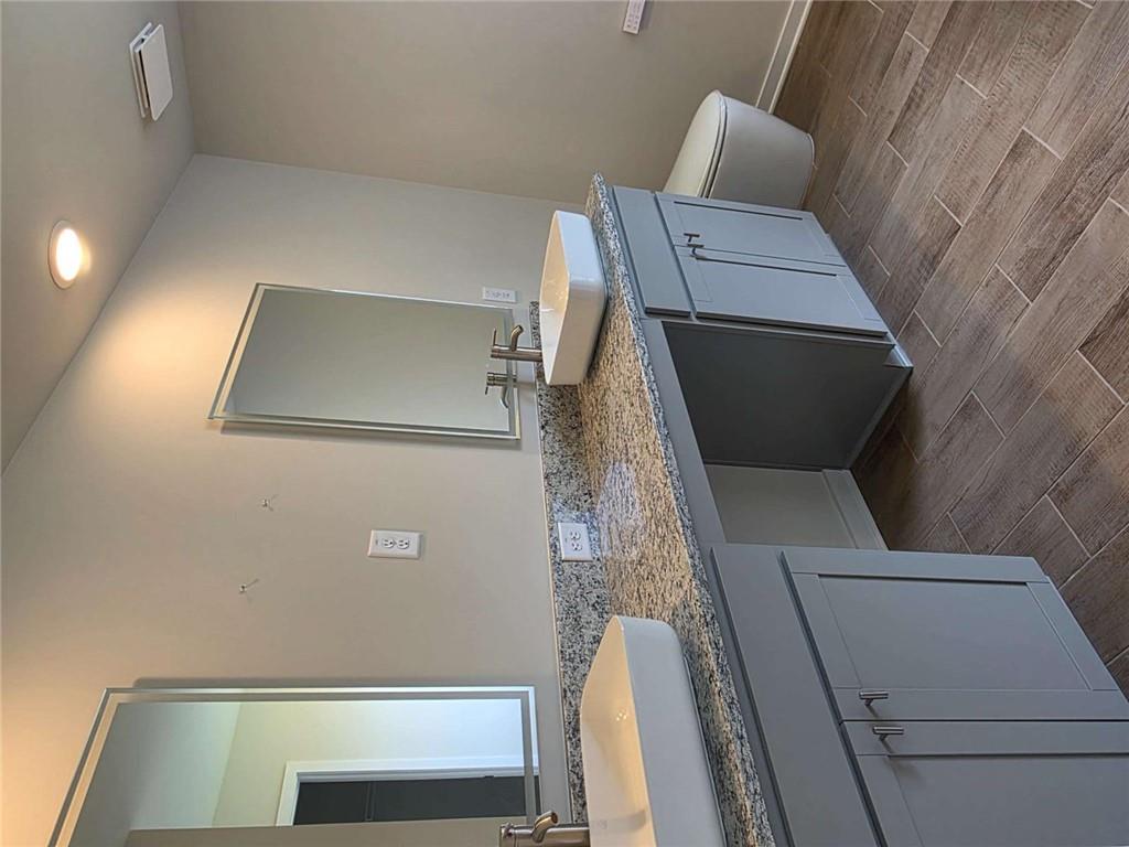 5372 Tolar Road South Fulton, GA 30213 - Photo 7 of 26 a bathroom with a granite countertop sink and a mirror