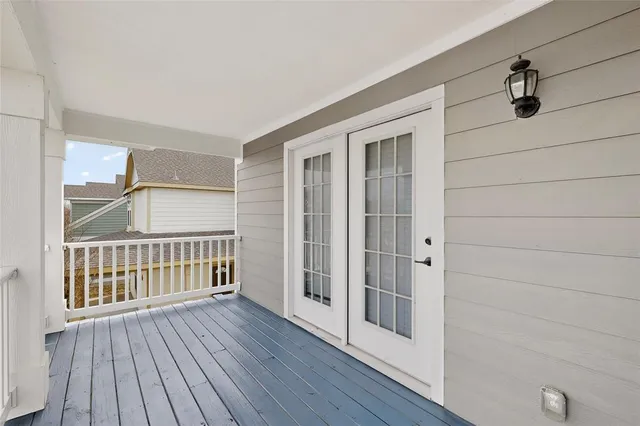 a view of a porch with wooden floor