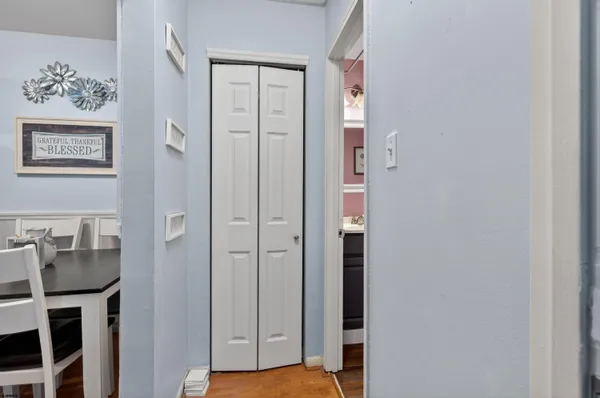 a view of a hallway with paintings on the wall