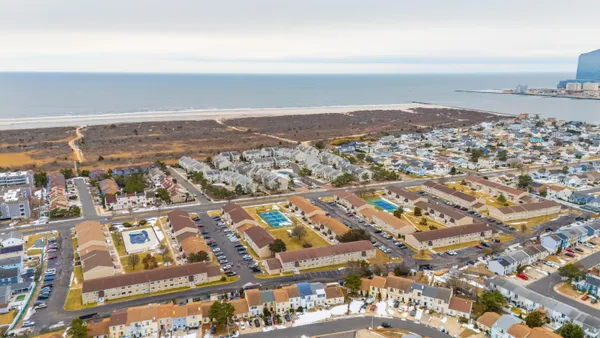 an aerial view of residential building with parking space