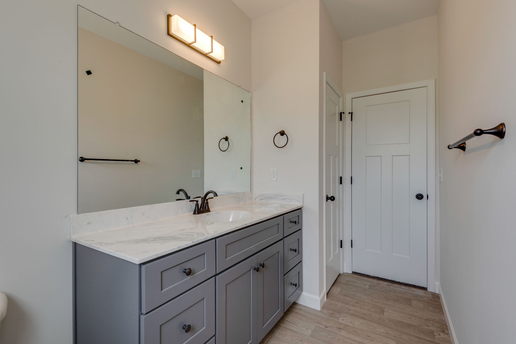 1224 Oak Grove Road Dickson, TN 37055 - Photo 18 of 28 a bathroom with a granite countertop sink a mirror and a vanity