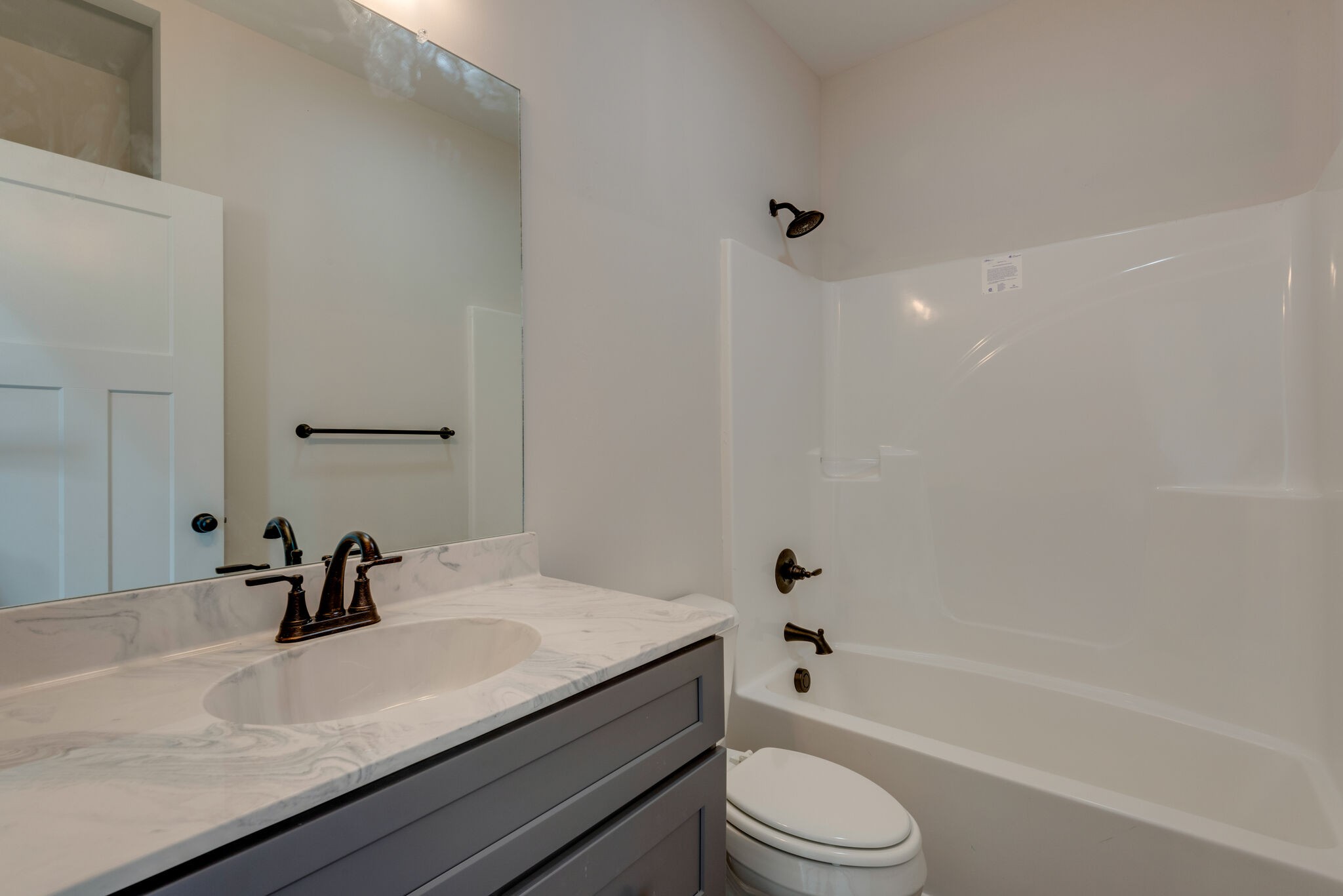 1224 Oak Grove Road Dickson, TN 37055 - Photo 23 of 28 a bathroom with a sink a toilet and a bathtub