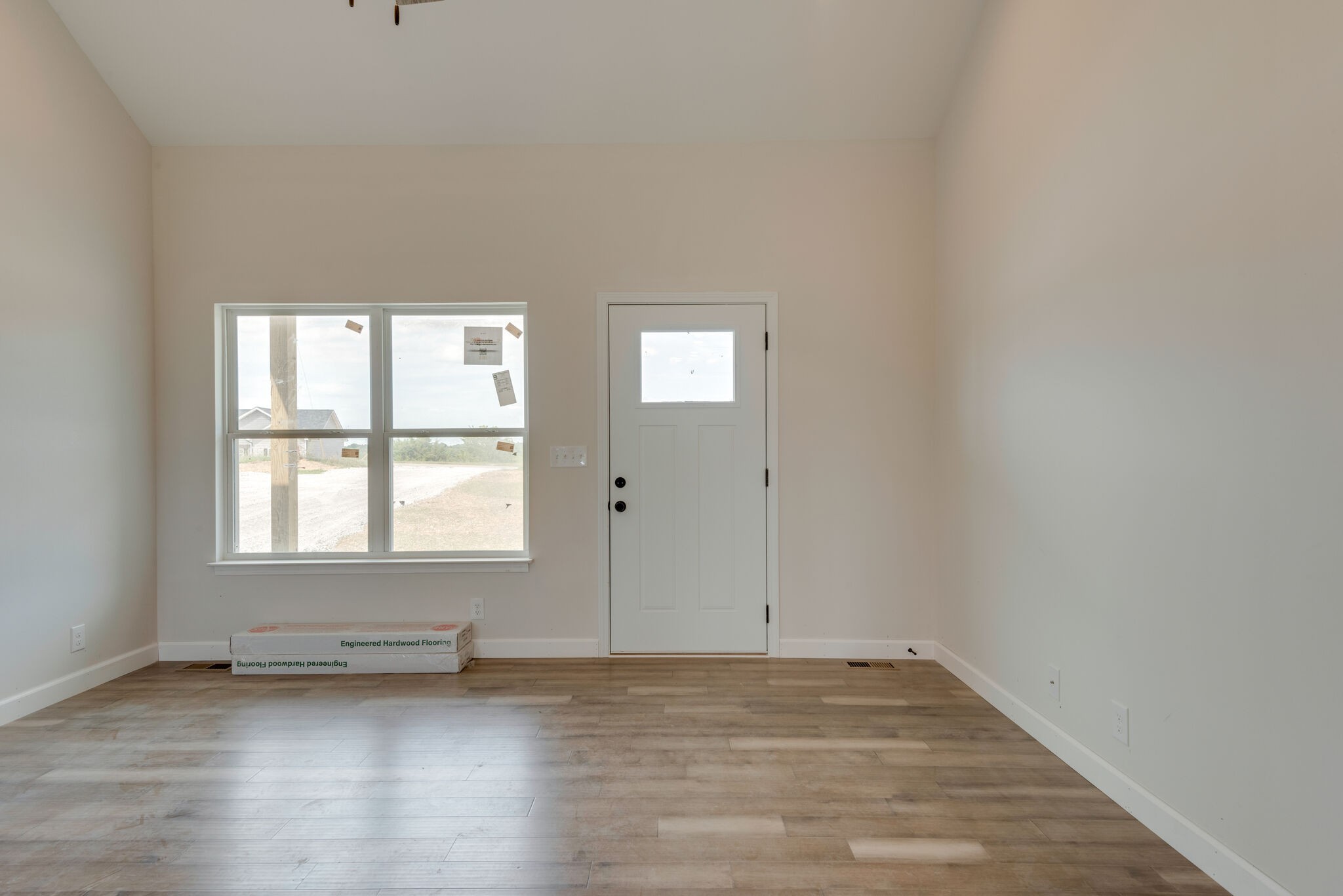 1224 Oak Grove Road Dickson, TN 37055 - Photo 4 of 28 an empty room with wooden floor and windows