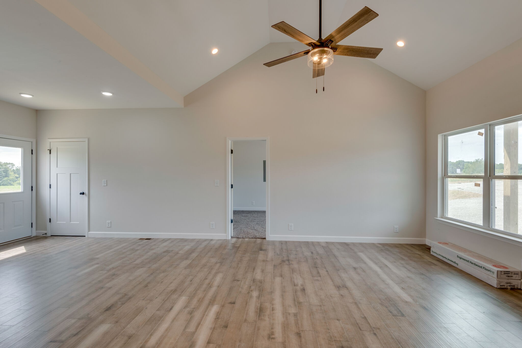 1224 Oak Grove Road Dickson, TN 37055 - Photo 7 of 28 an empty room with wooden floor and windows