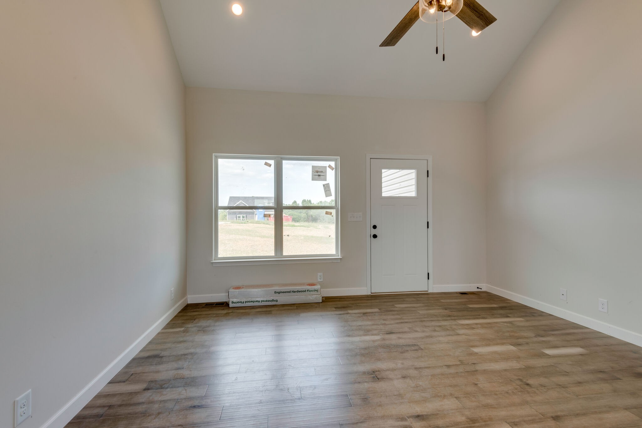 1224 Oak Grove Road Dickson, TN 37055 - Photo 8 of 28 an empty room with wooden floor and windows